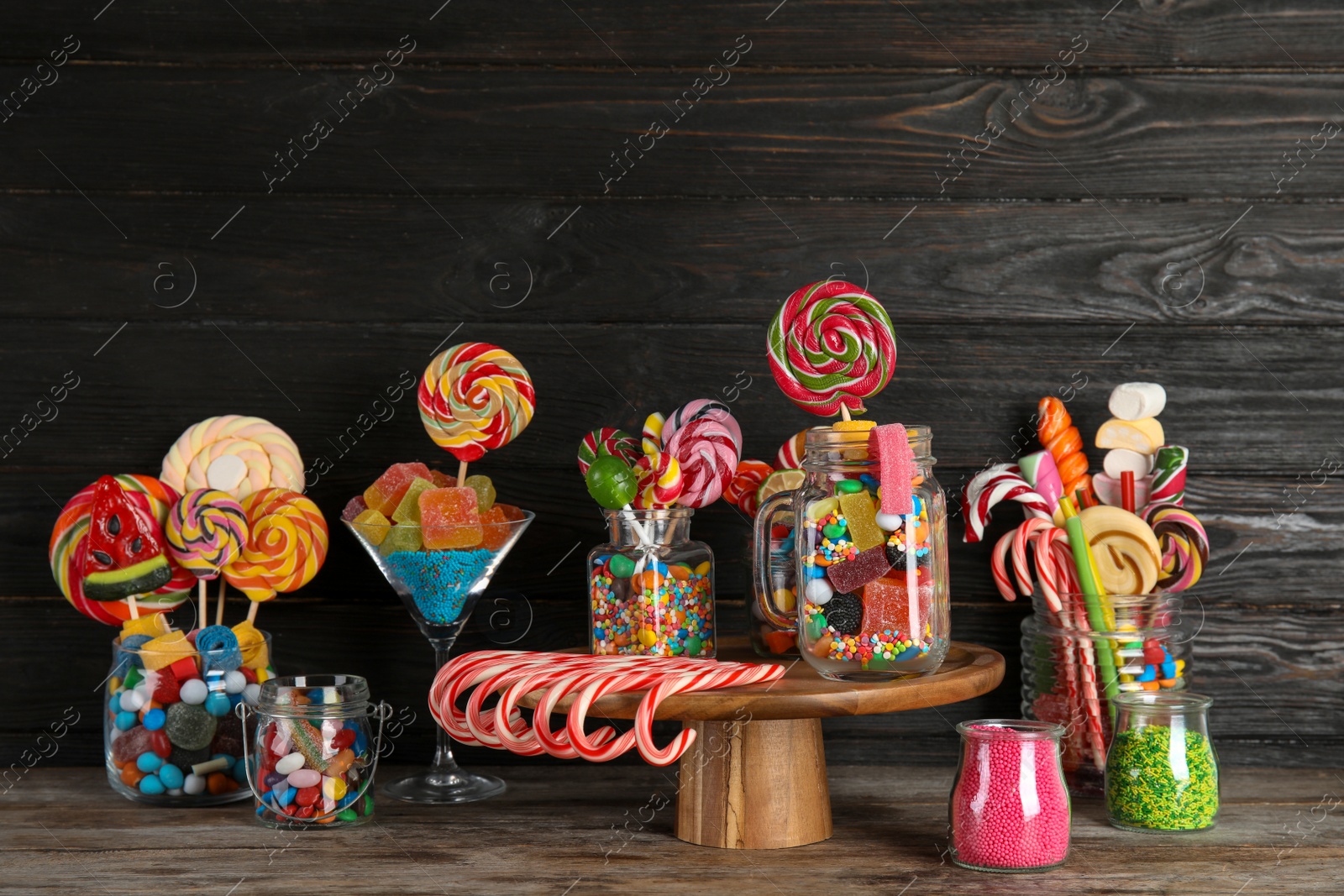 Photo of Composition with many different candies on table