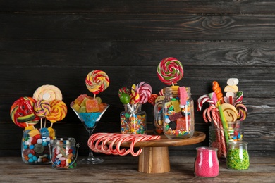 Composition with many different candies on table