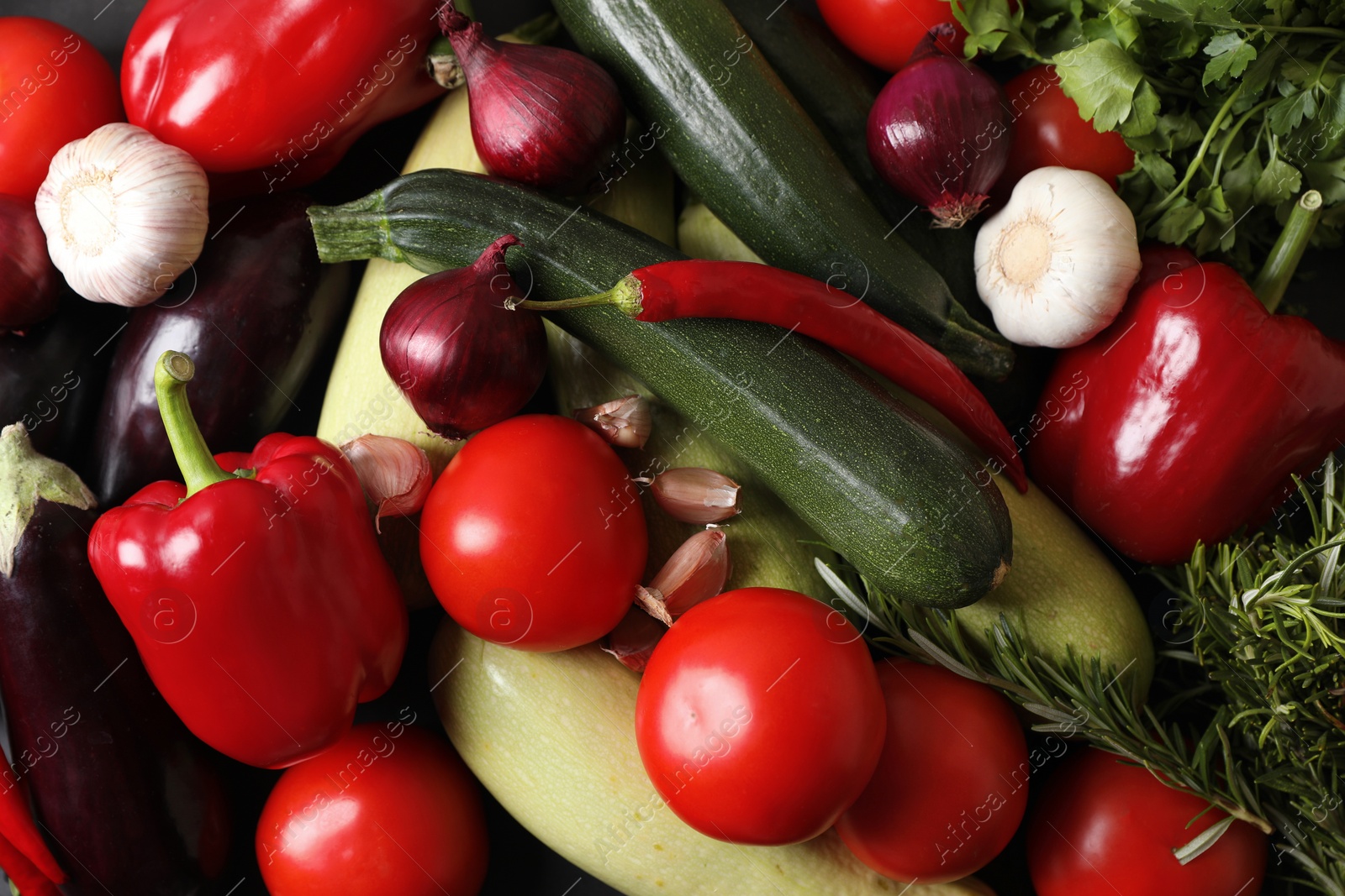 Photo of Cooking delicious ratatouille. Fresh ripe vegetables as background, top view