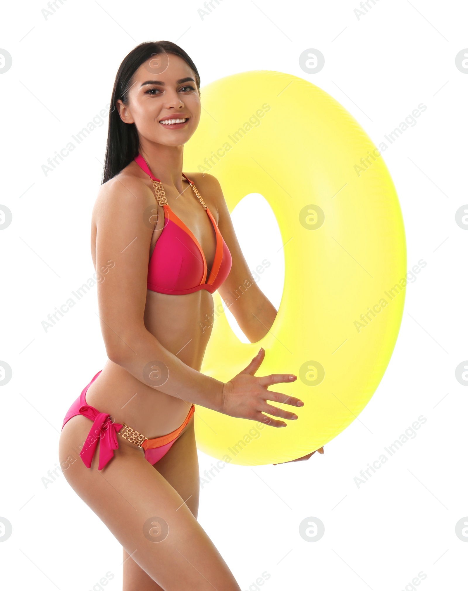 Photo of Beautiful young woman in stylish bikini with inflatable ring on white background