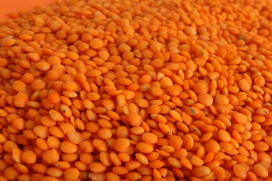 Organic red lentils as background, closeup view