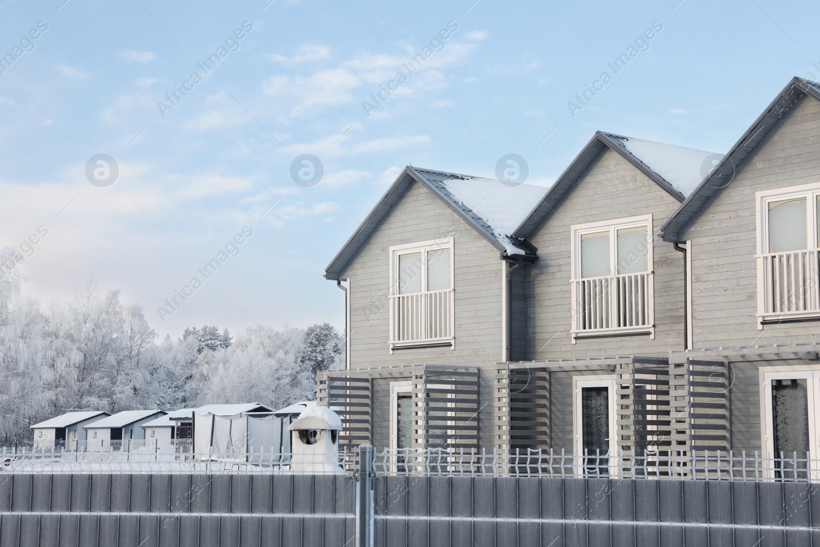 Photo of Winter landscape with beautiful houses and trees in morning