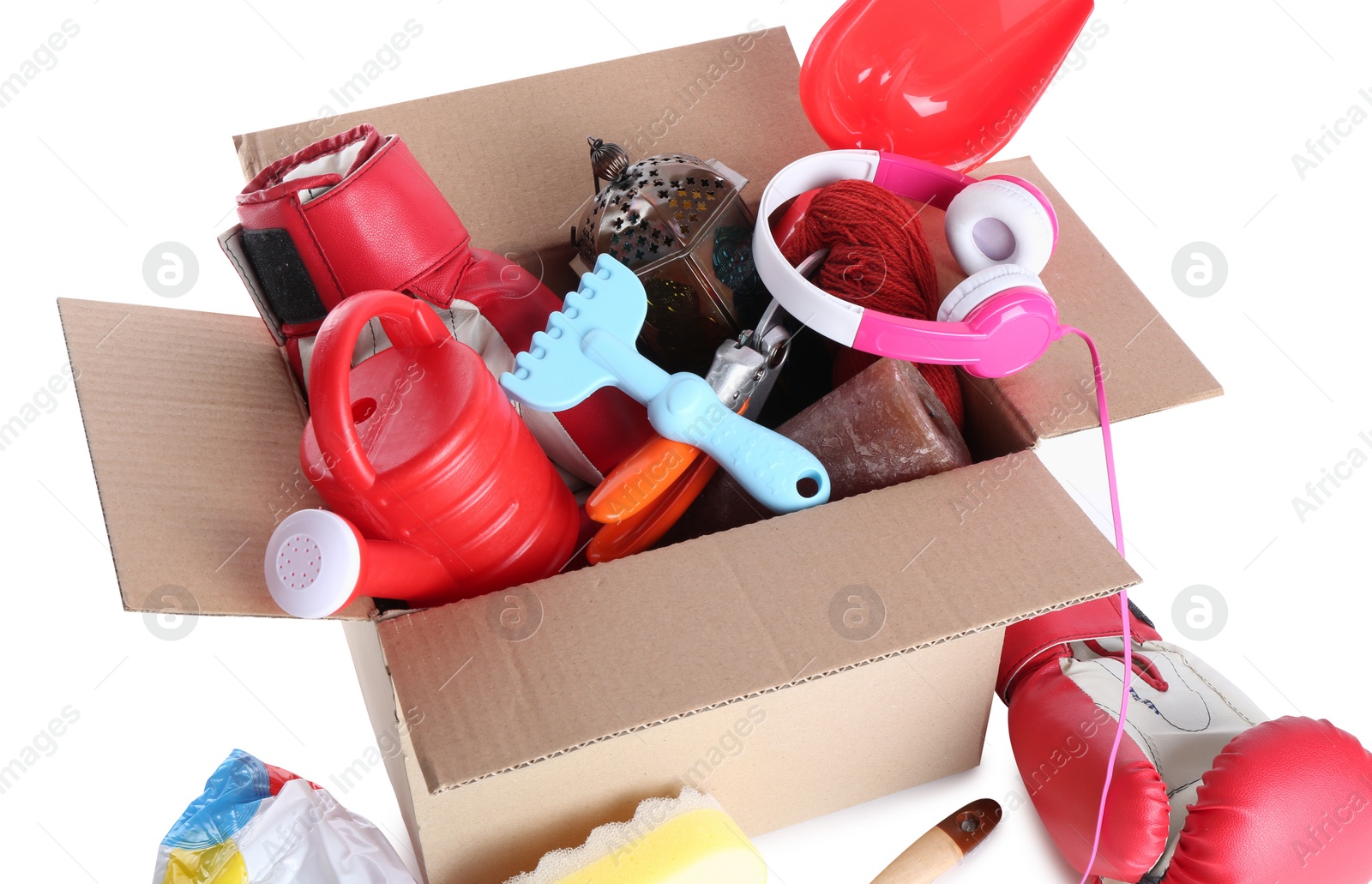 Photo of Box of unwanted stuff isolated on white