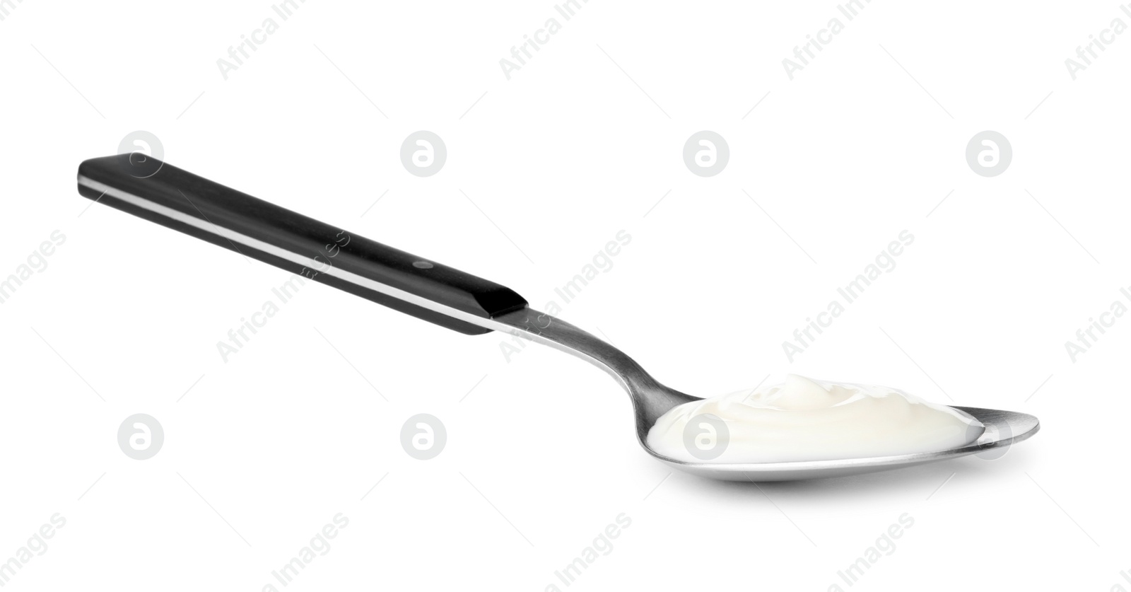 Photo of Metal spoon with sour cream on white background