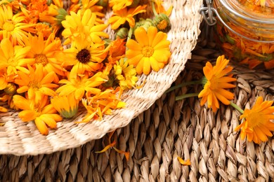 Beautiful fresh calendula flowers on wooden table, above view