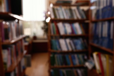 Blurred view of different books on shelves in library