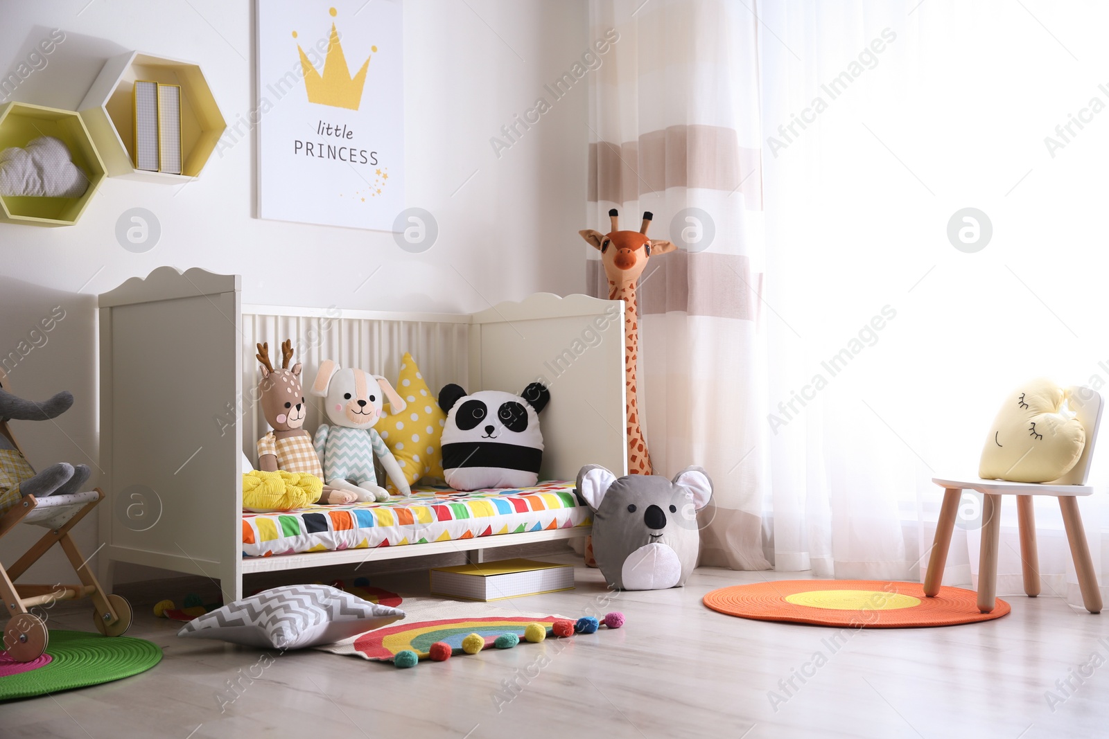 Photo of Baby room interior with stylish furniture and toys