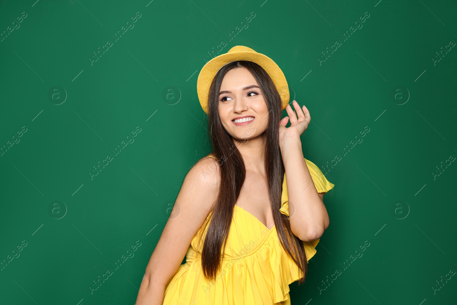 Photo of Portrait of beautiful young woman in stylish clothes on color background