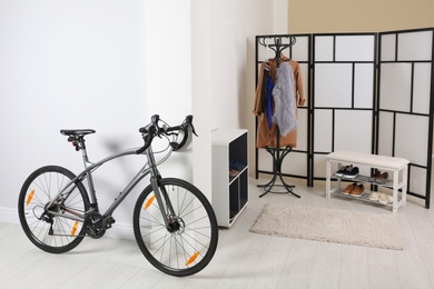 Photo of Modern apartment interior with bicycle near wall