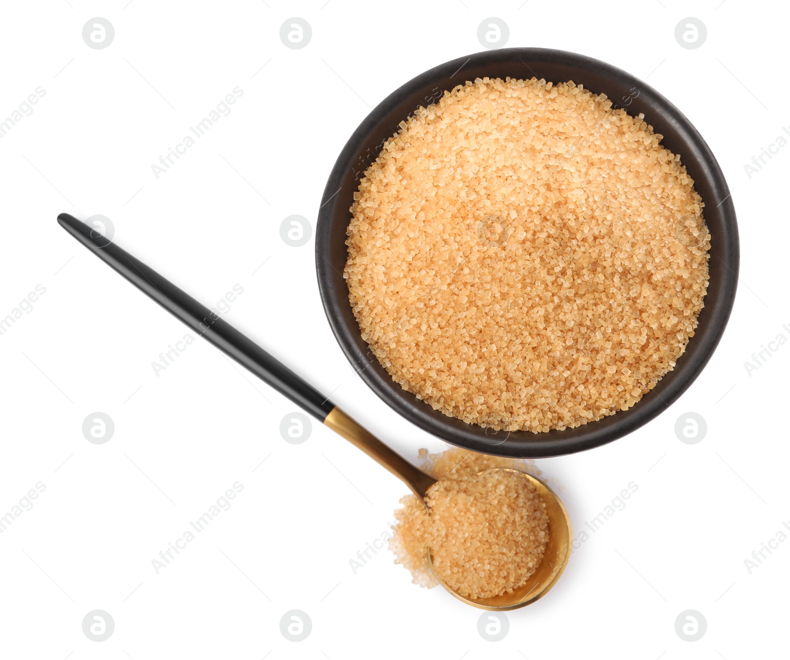 Photo of Bowl of granulated brown sugar and spoon on white background, top view