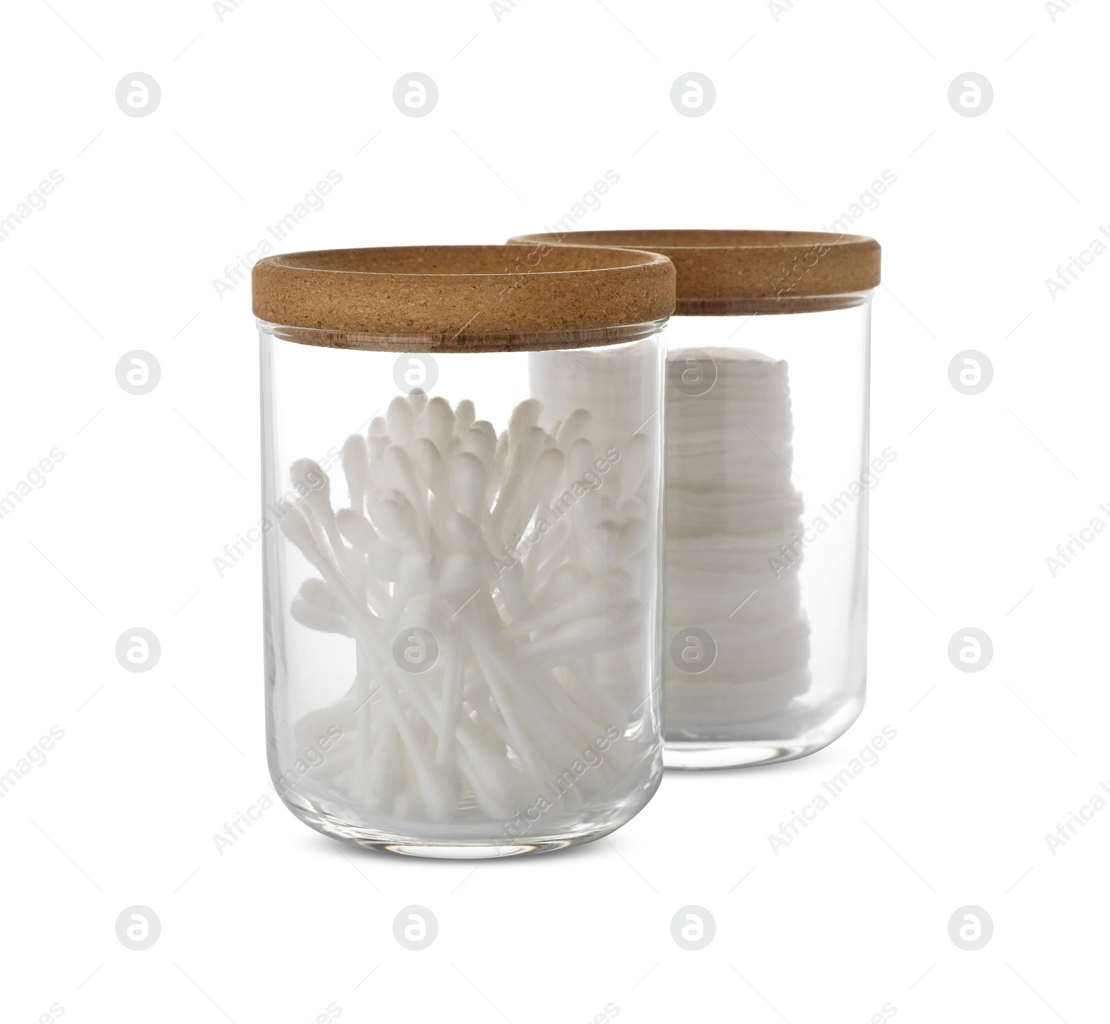 Photo of Cotton pads and swabs in glass jars on white background