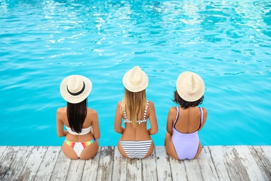 Photo of Group of friends near outdoor swimming pool