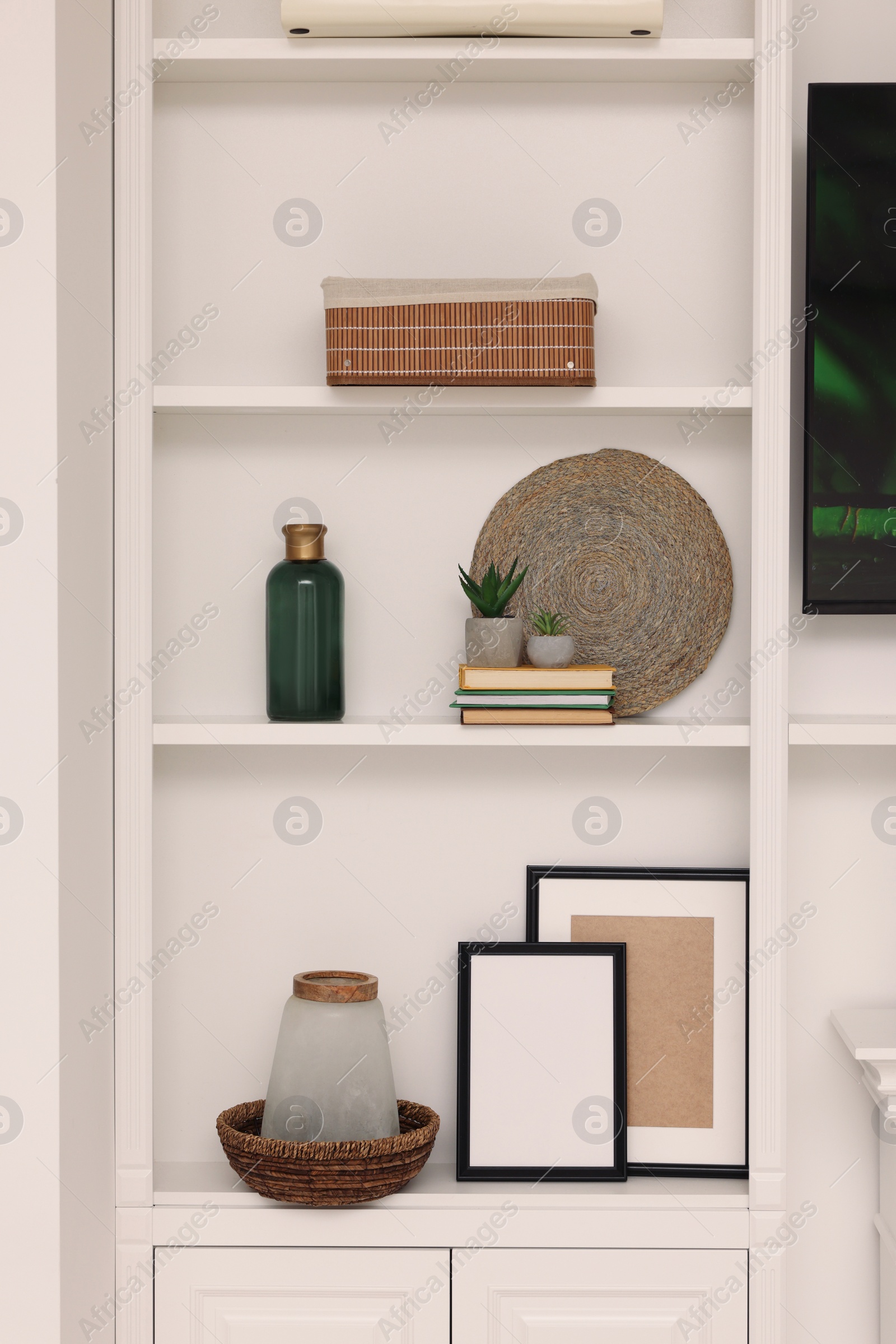 Photo of Shelves with different decor indoors. Interior design