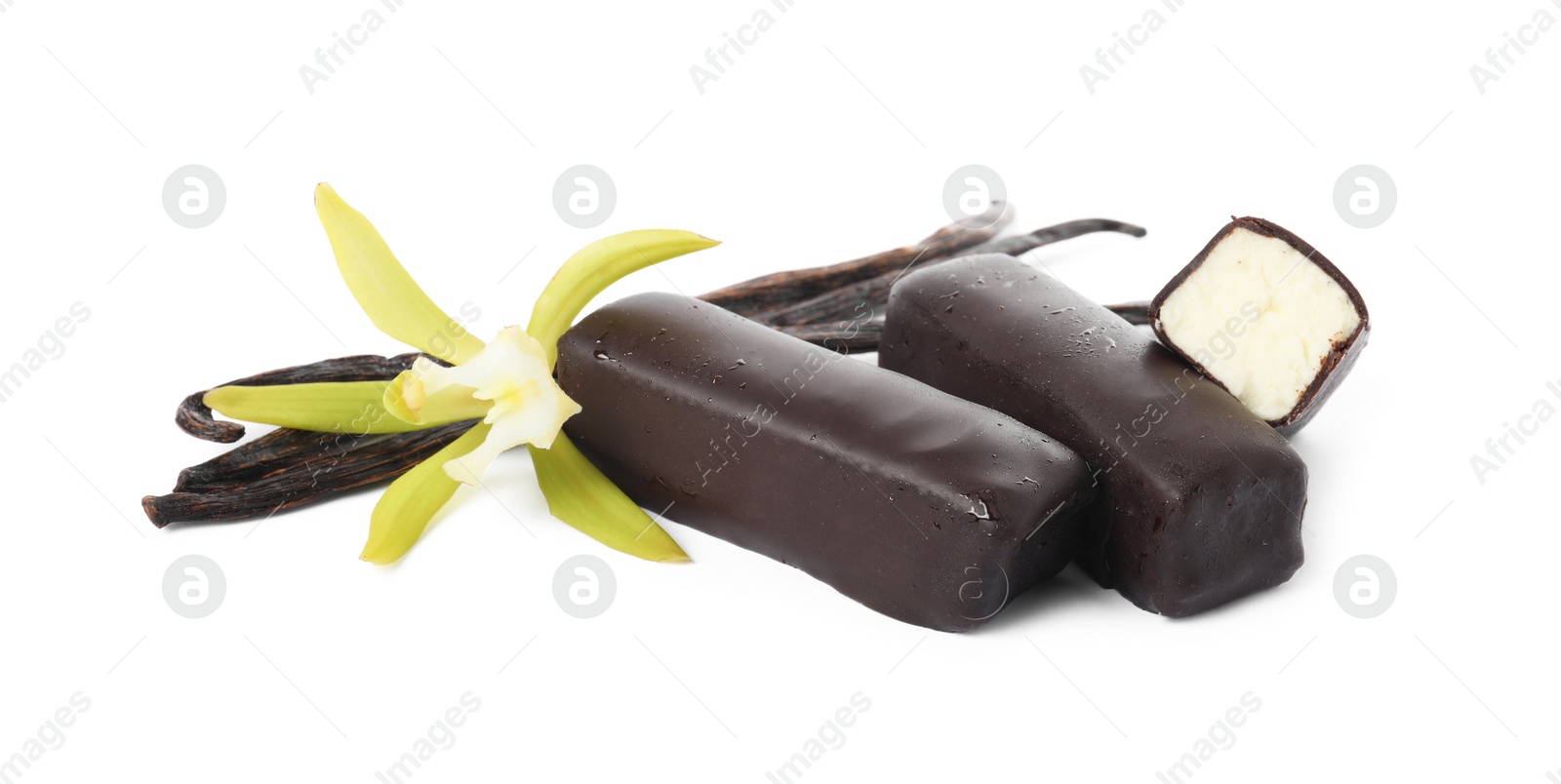 Photo of Glazed curd cheese bars, vanilla pods and flower isolated on white