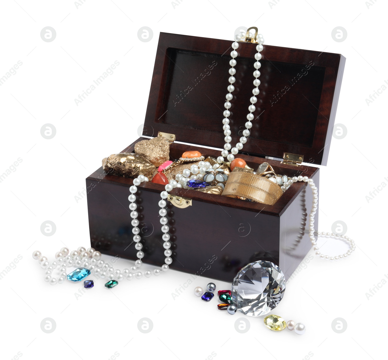 Photo of Wooden chest with treasures isolated on white