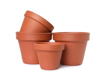 Photo of Empty clay flower pots isolated on white