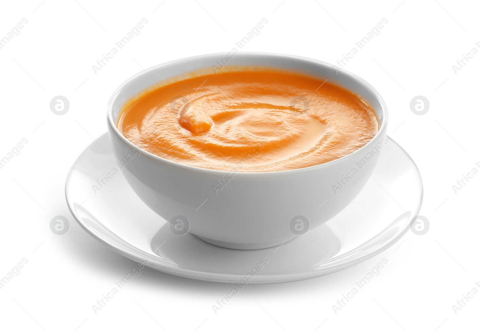 Photo of Delicious pumpkin cream soup in bowl on white background