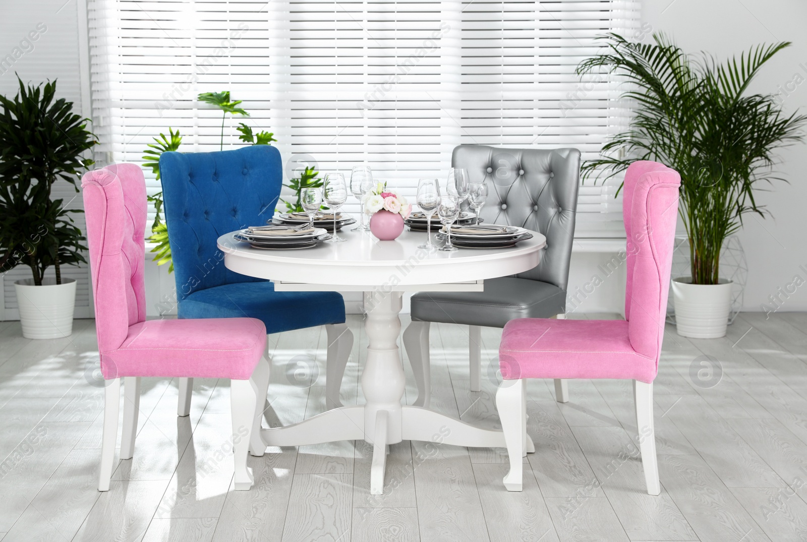 Photo of Elegant dining room interior with stylish chairs and table