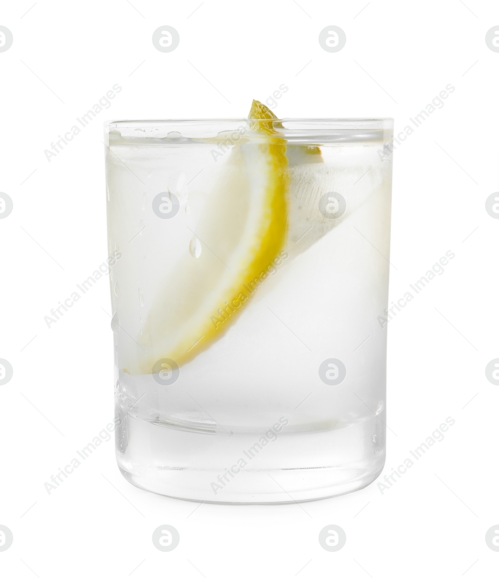 Photo of Glass of vodka with lemon isolated on white