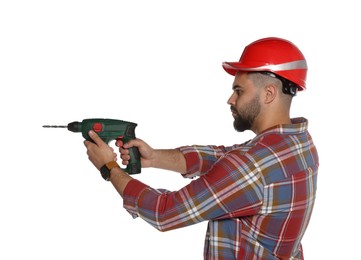 Photo of Young worker in hard hat with power drill on white background