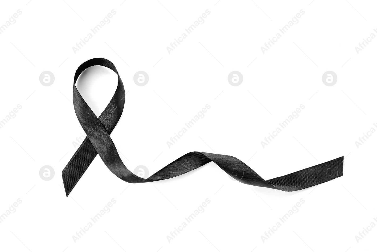 Photo of Black ribbon on white background. Funeral accessory