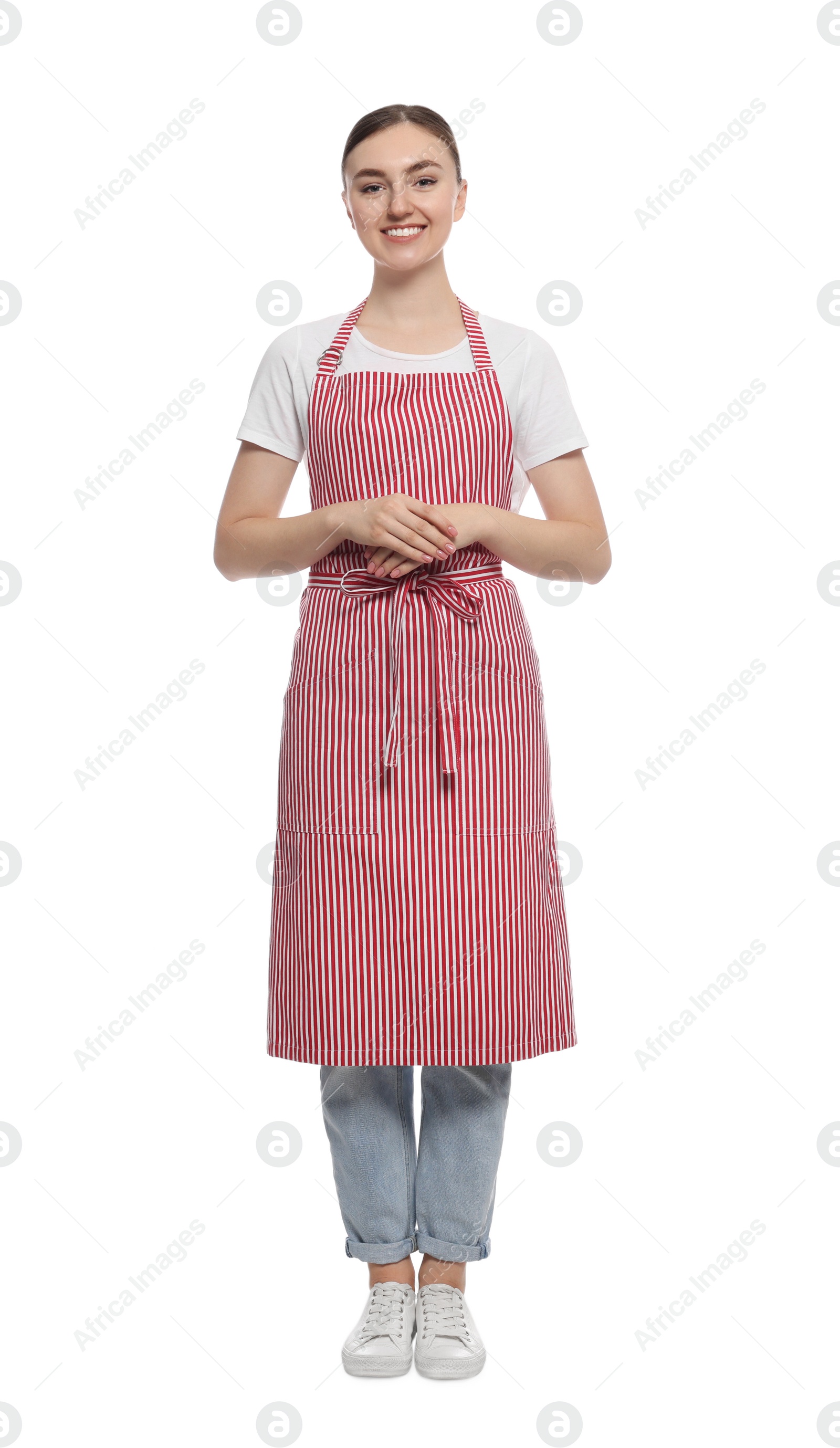 Photo of Beautiful young woman in clean striped apron on white background