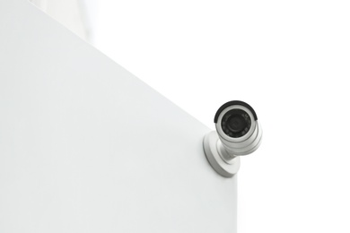 Modern CCTV security camera on building outdoors. Space for text