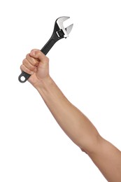 Photo of Male plumber holding adjustable wrench on white background, closeup