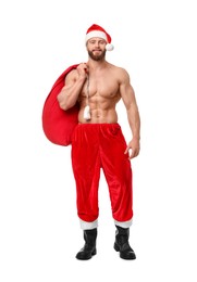 Muscular young man in Santa hat holding bag with presents on white background