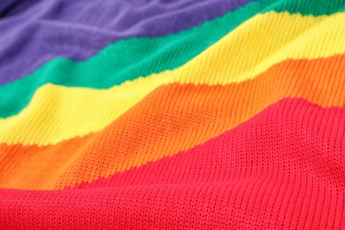 Photo of Texture of cozy warm sweater as background, closeup