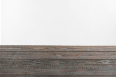 Photo of Empty wooden surface on white background. Space for text
