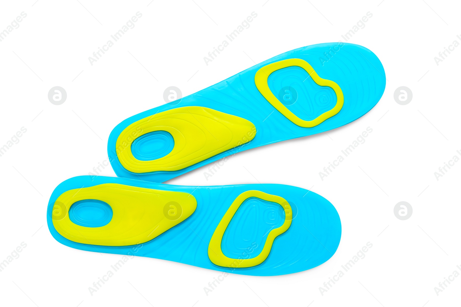 Photo of Light blue orthopedic insoles isolated on white, top view