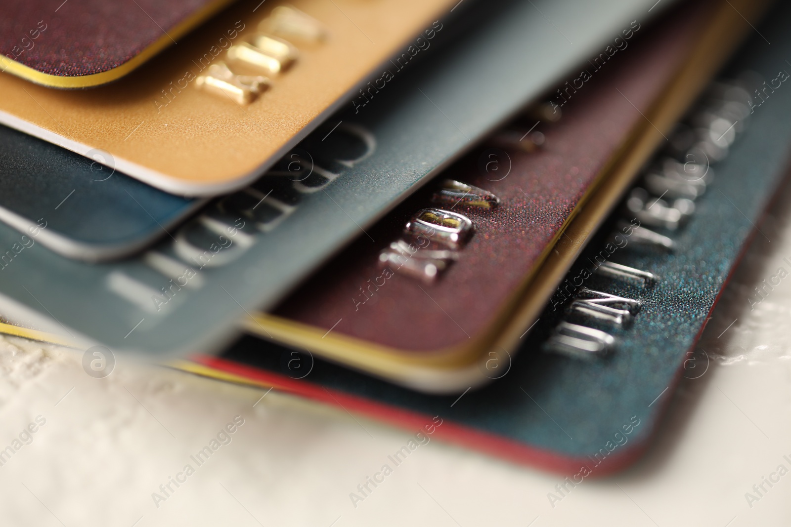 Photo of Plastic credit cards on table, macro view