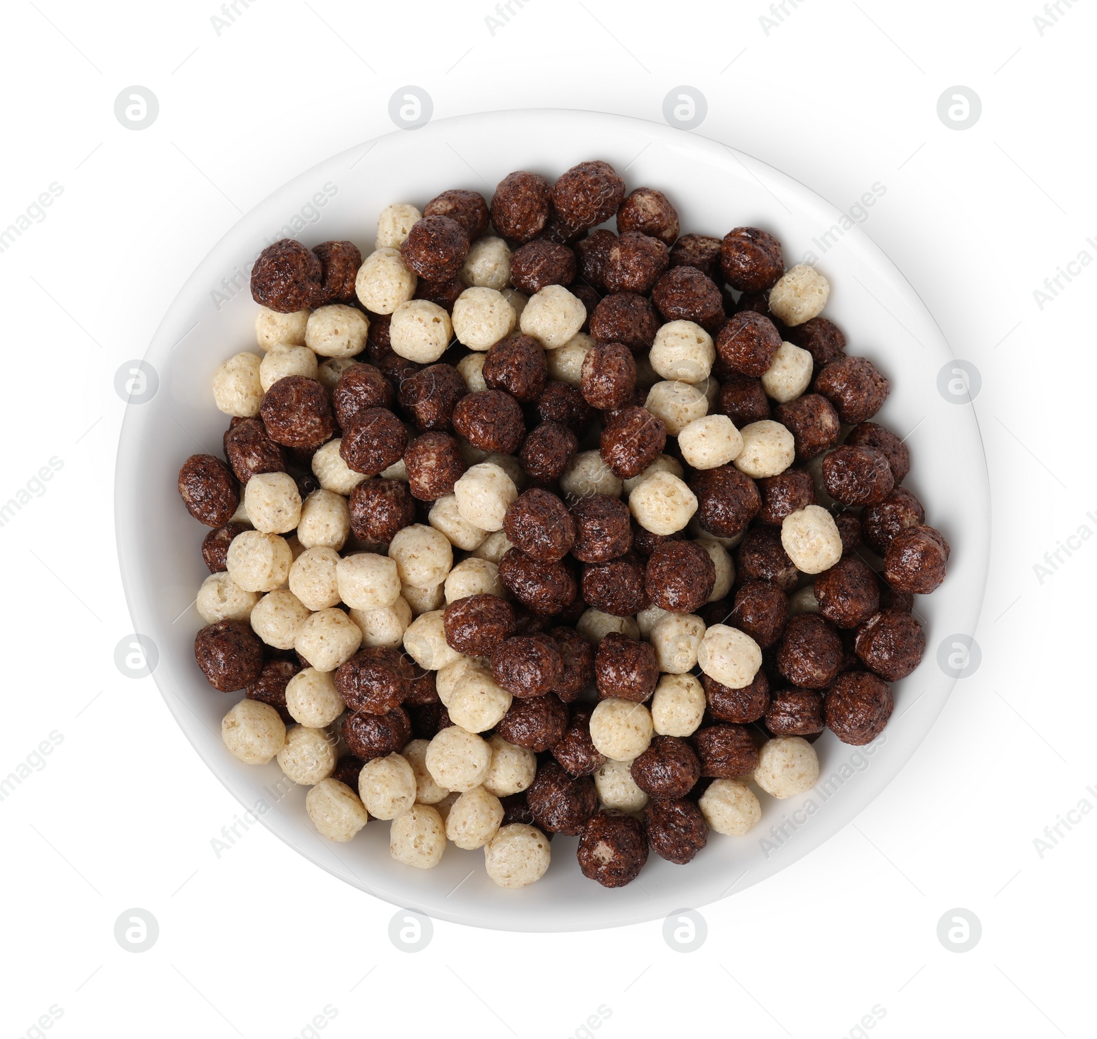 Photo of Tasty cereal balls in bowl isolated on white, top view