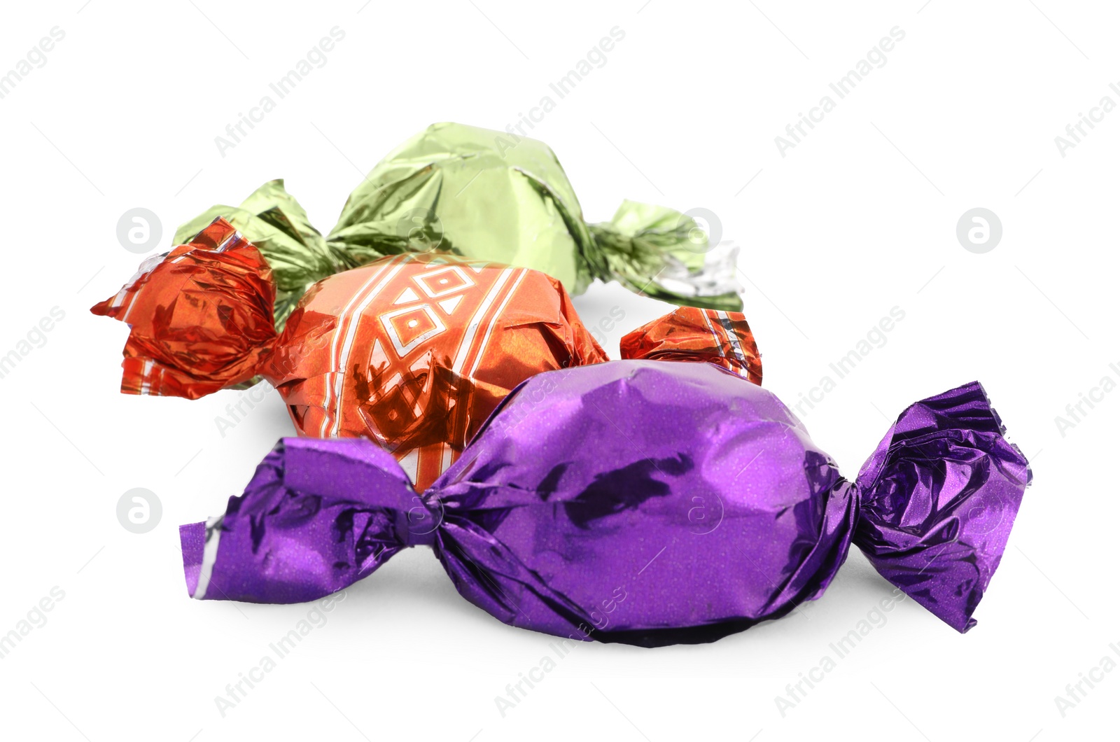 Photo of Sweet candies in colorful wrappers on white background