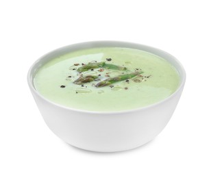 Delicious asparagus soup in bowl on white background