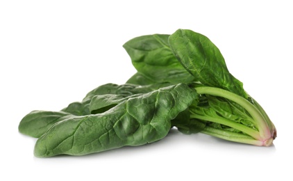 Fresh green healthy spinach leaves isolated on white