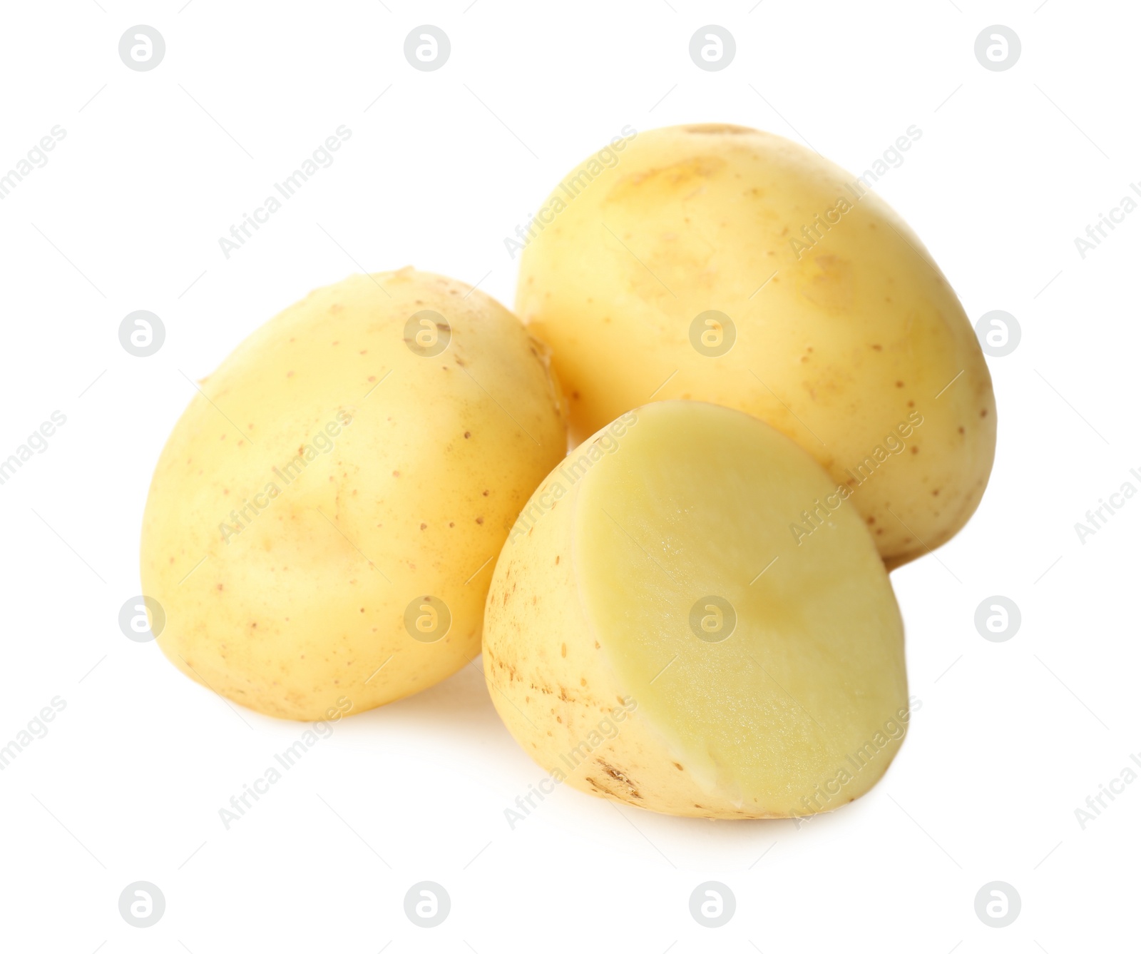 Photo of Whole and cut fresh raw organic potatoes on white background