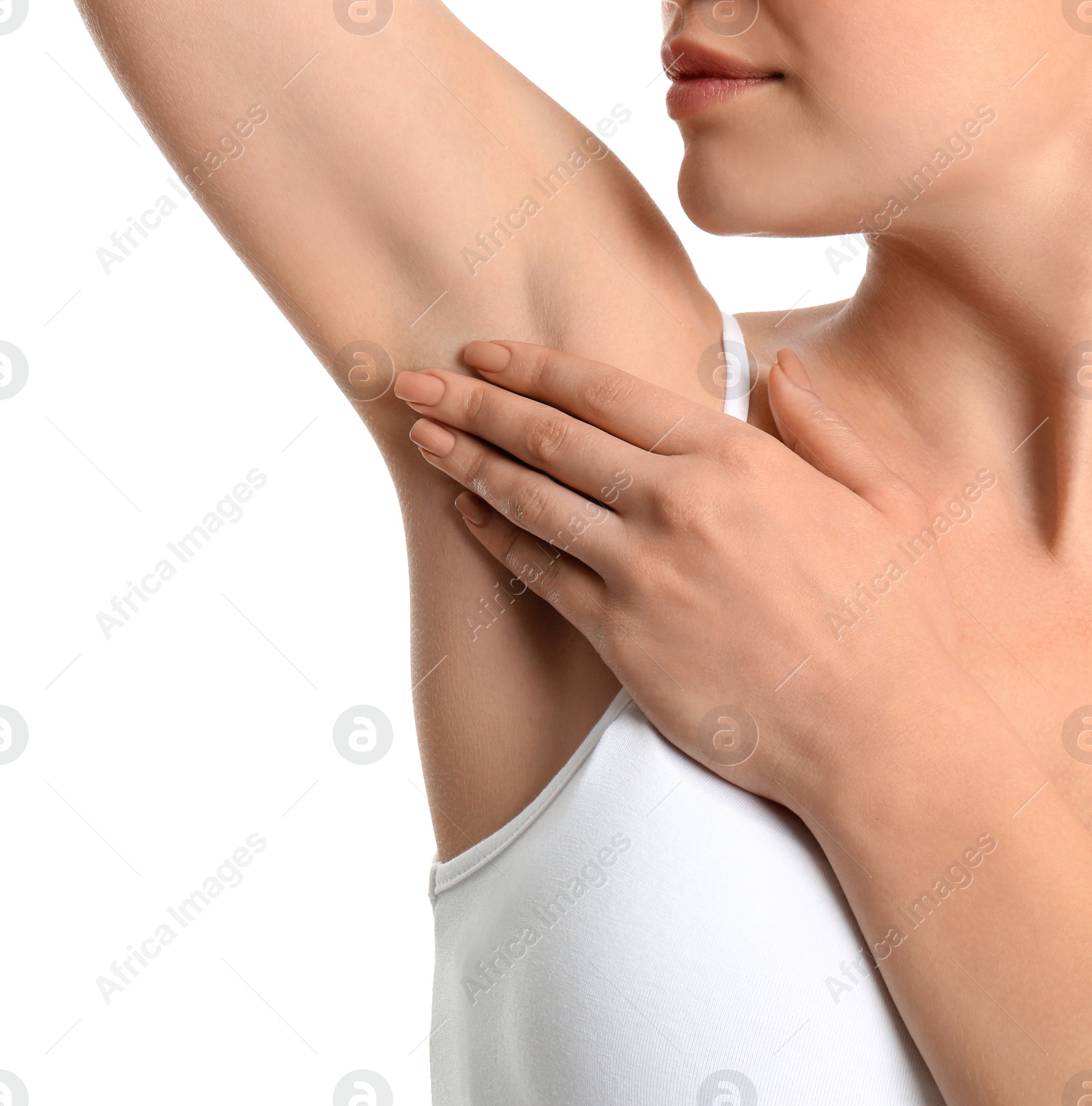 Photo of Young woman showing armpit with smooth clean skin on white background, closeup