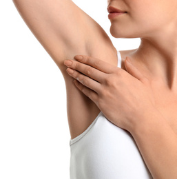 Young woman showing armpit with smooth clean skin on white background, closeup