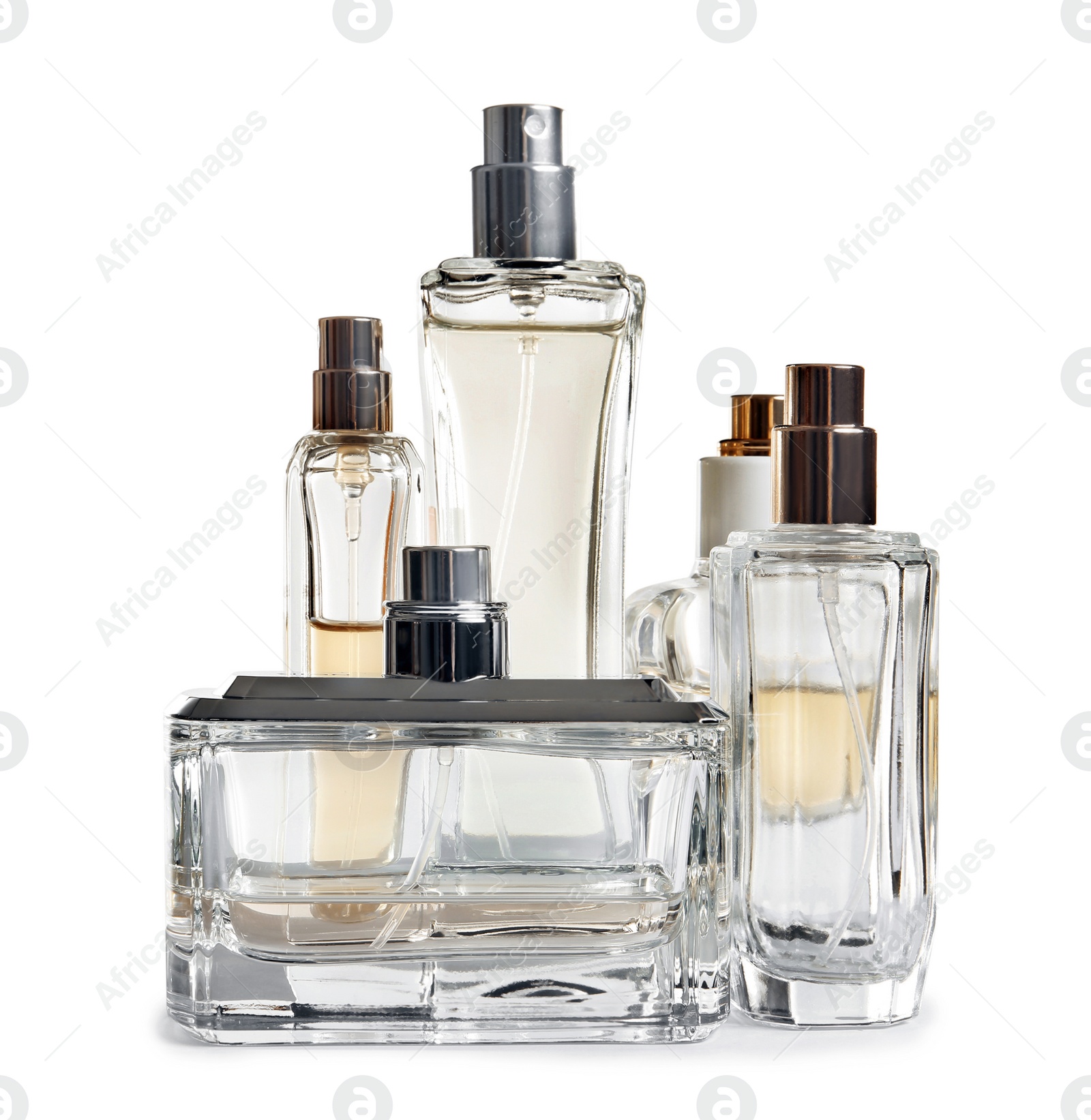 Photo of Different perfume bottles on white background