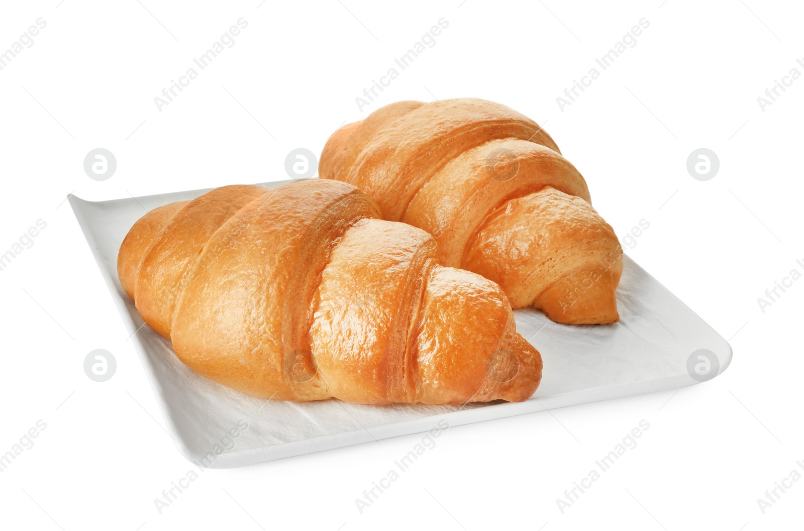 Photo of Plate with delicious fresh croissants isolated on white