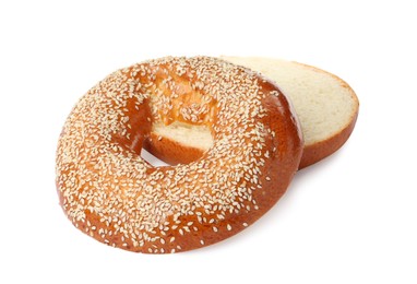 Photo of Delicious fresh halved bagel isolated on white
