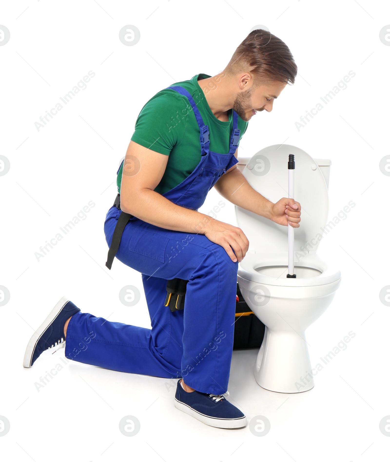 Photo of Young man working with toilet bowl, isolated on white