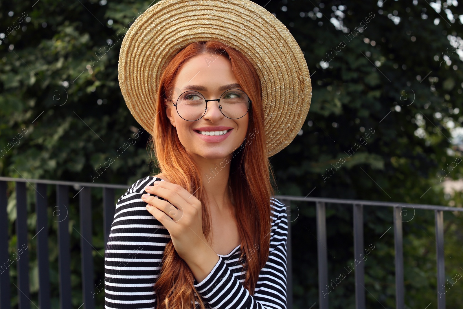 Photo of Portrait of beautiful woman in glasses outdoors