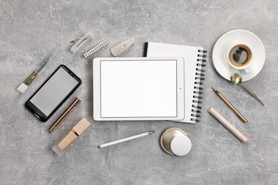 Photo of Flat lay composition with modern tablet on light grey table. Space for text