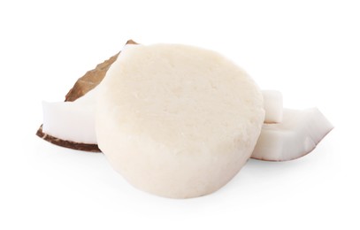 Photo of Solid shampoo bar and coconut pieces on white background. Hair care