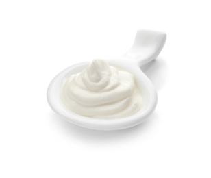 Photo of Serving spoon with sour cream on white background