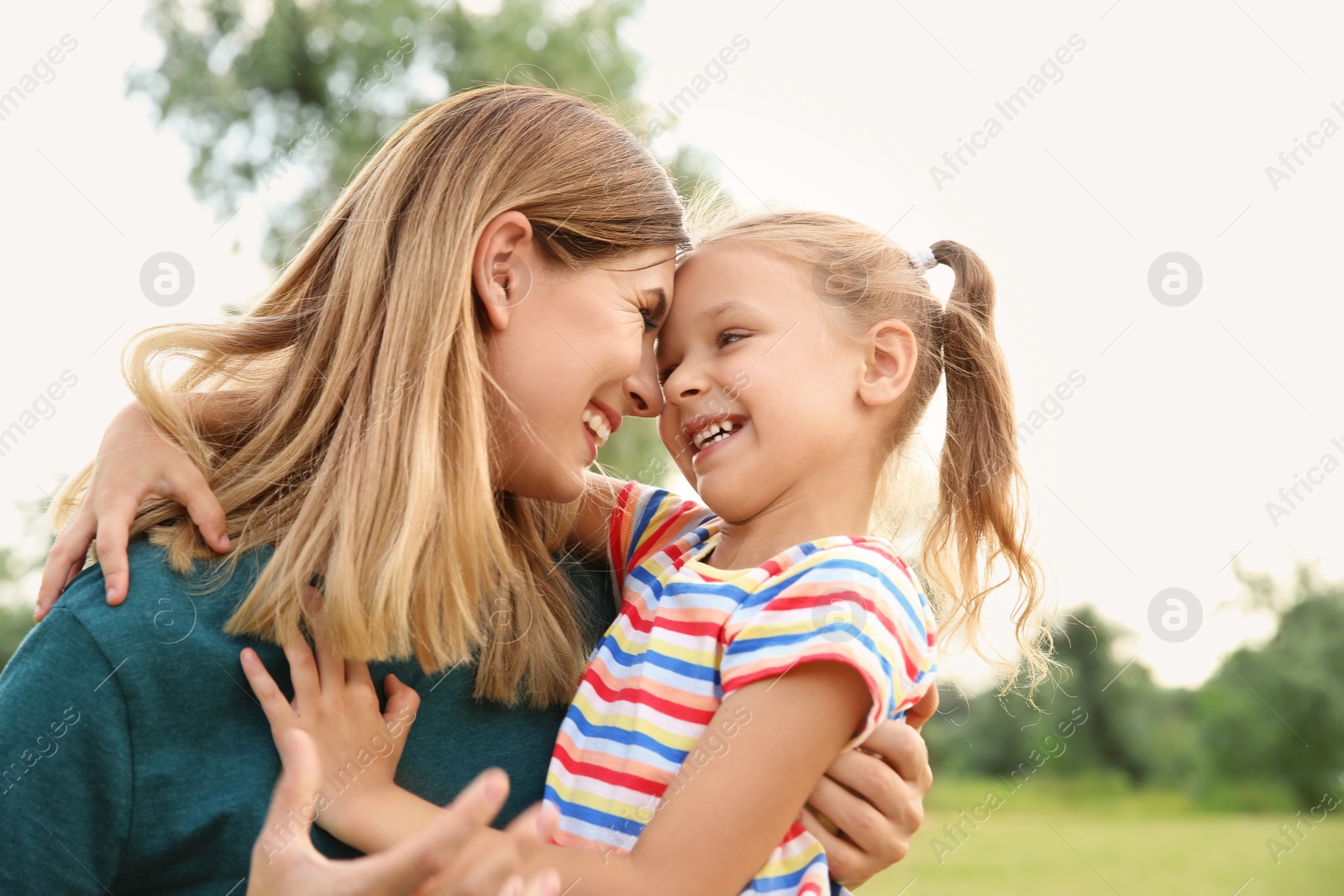 Photo of Woman with her child outdoors. Happy family