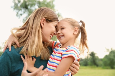 Woman with her child outdoors. Happy family